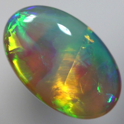 SOLID CRYSTAL OPAL Large bright chasing rolling flashes of rich orange and green